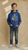 Boy smiling wearing a royal hoodie with a football graphic on it.
