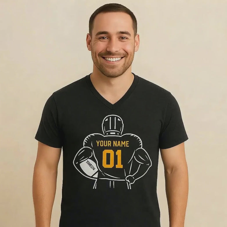 Video of a man wearing a black t-shirt with a customizable football graphic against a beige background
