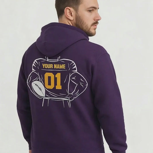 Video of a man wearing a purple hoodie with a customizable football design on a white background
