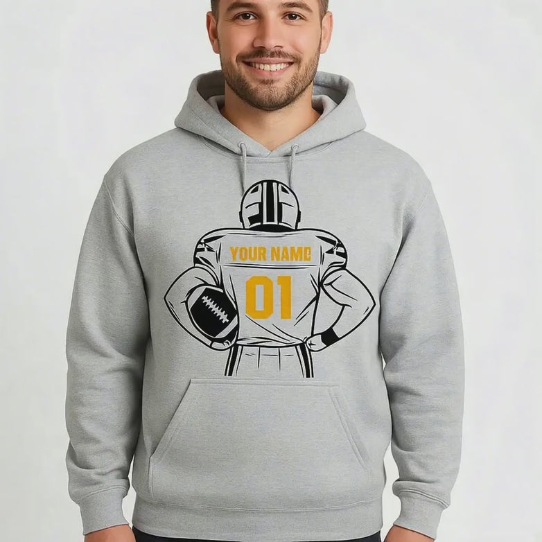Man wearing a sport grey hoodie with a customizable football graphic against a white backgroumd
