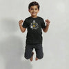 Little boy jumping in a black t-shirt with a customizable football graphic against a white background