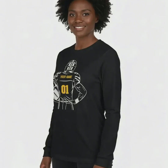 Woman wearing a customizable football long sleeve t-shirt against a white background